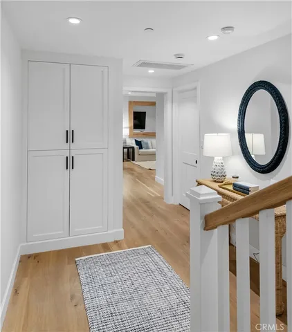 a living room with a fireplace and a rug