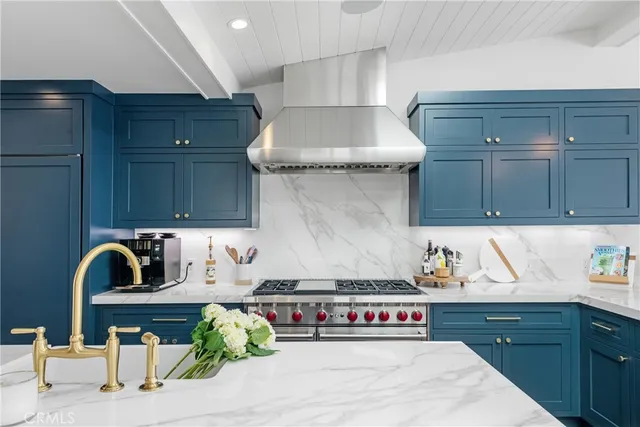 a kitchen with a stove and cabinets