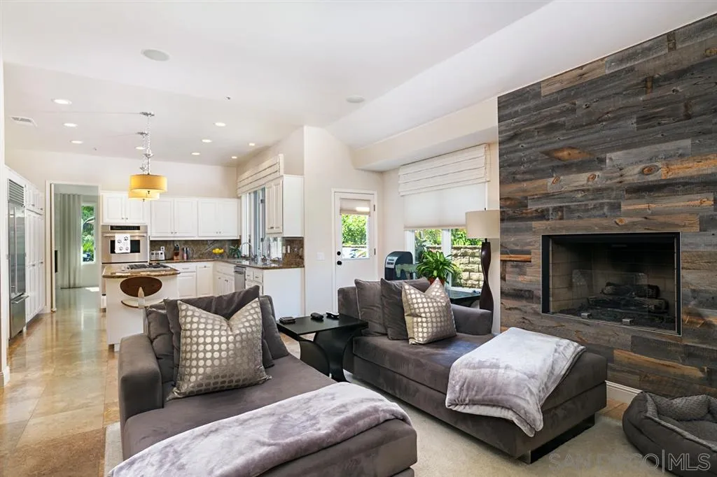 14150 Steeple Chase Row San Diego, CA 92130 - Photo 12 of 25 a living room with furniture and a fireplace