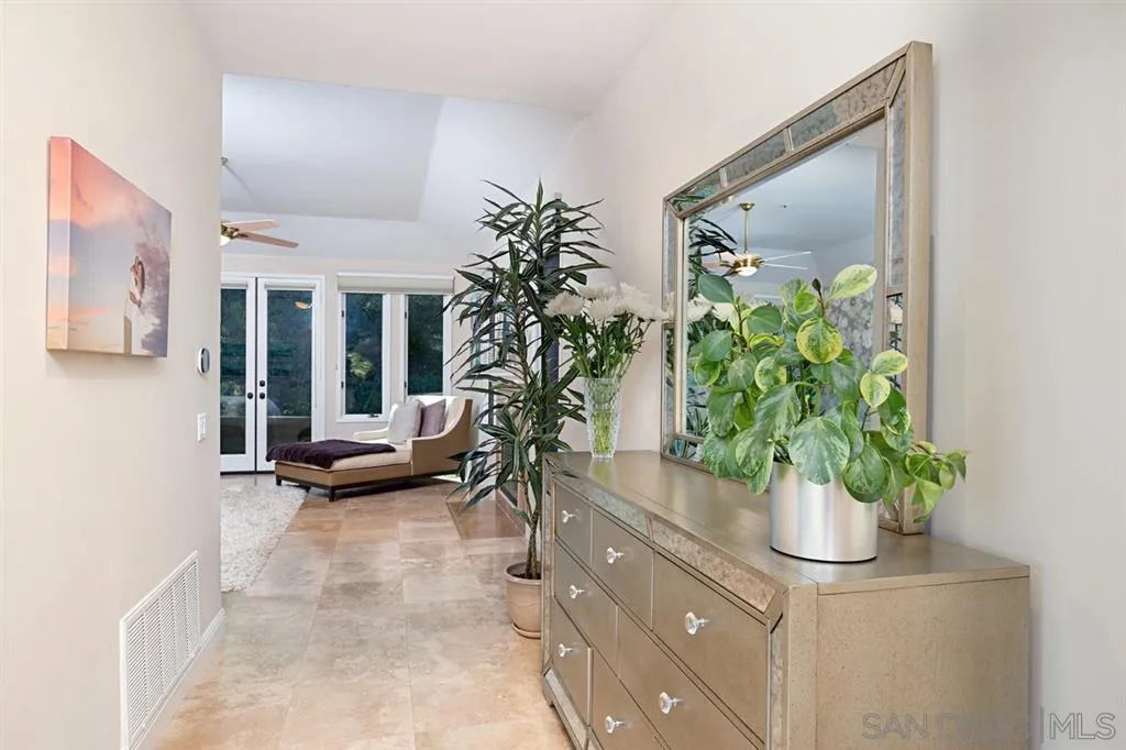 14150 Steeple Chase Row San Diego, CA 92130 - Photo 15 of 25 a potted plant sitting in front of a room
