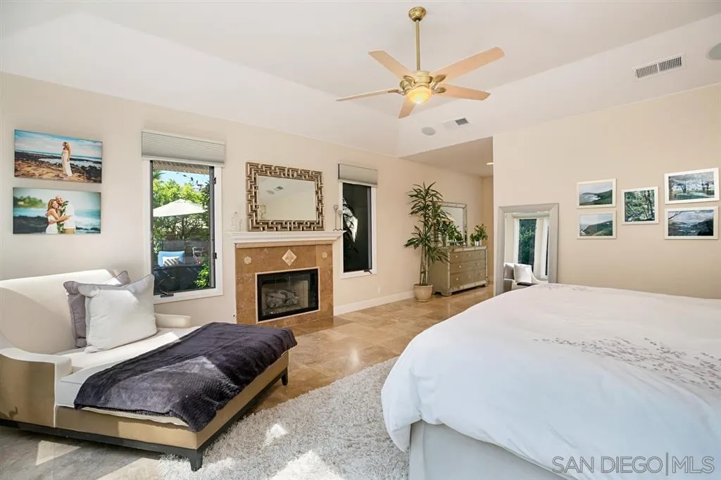 14150 Steeple Chase Row San Diego, CA 92130 - Photo 17 of 25 a living room with furniture and a fireplace