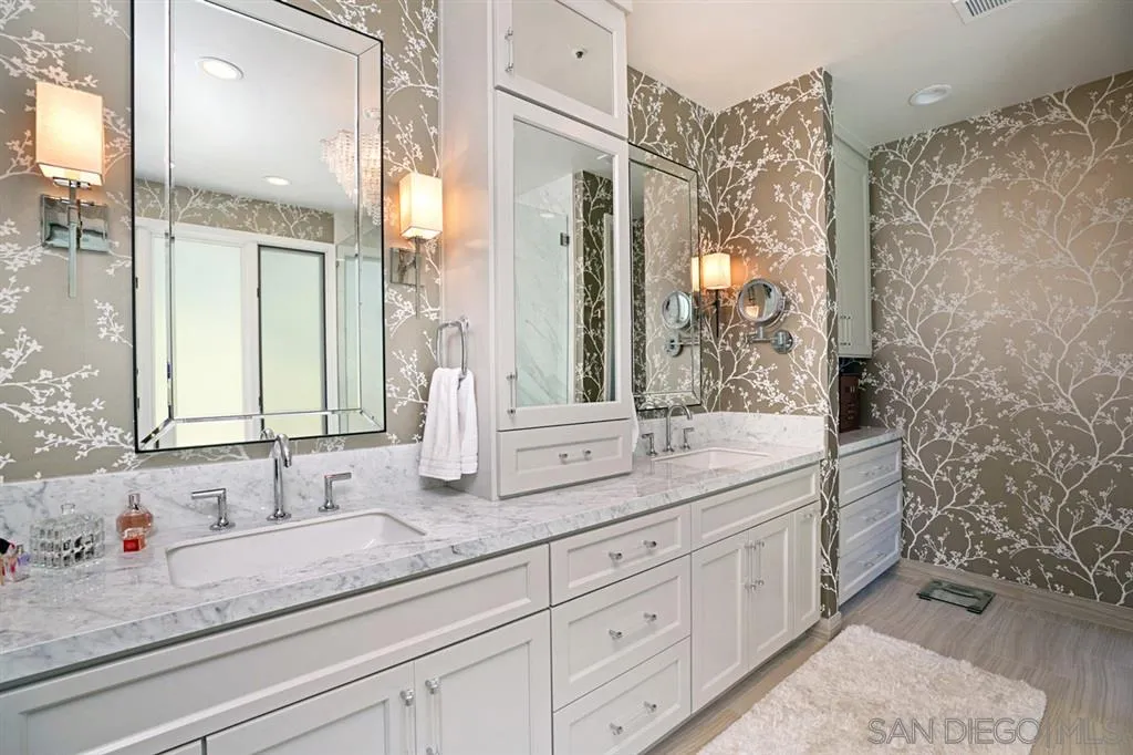 14150 Steeple Chase Row San Diego, CA 92130 - Photo 20 of 25 a bathroom with double sink and a mirror