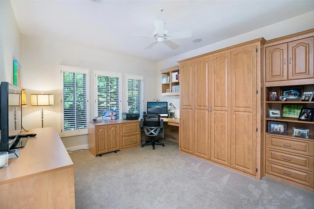 14150 Steeple Chase Row San Diego, CA 92130 - Photo 23 of 25 a bed room with furniture and a window