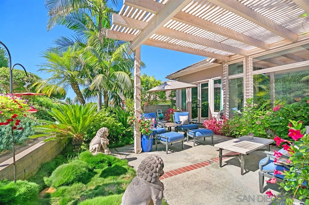 14150 Steeple Chase Row San Diego, CA 92130 - Photo 9 of 25 a view of a patio with table and chairs potted plants