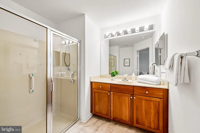 a spacious bathroom with a double vanity sink and a mirror