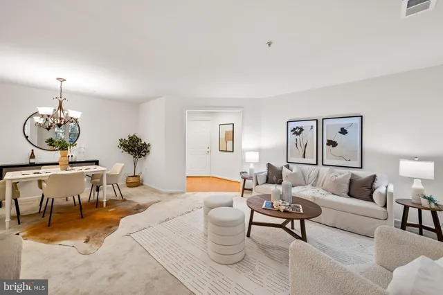 a living room with furniture and a table