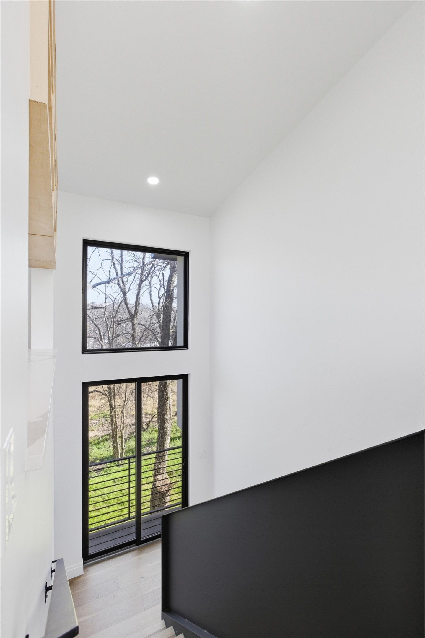 5013 Rob-Scott Street Austin, TX 78721 - Photo 22 of 35 Stairway leading downstairs with a Juliet Balcony.