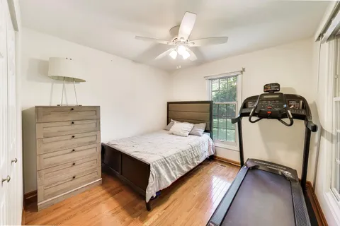a bedroom with a bed and closet