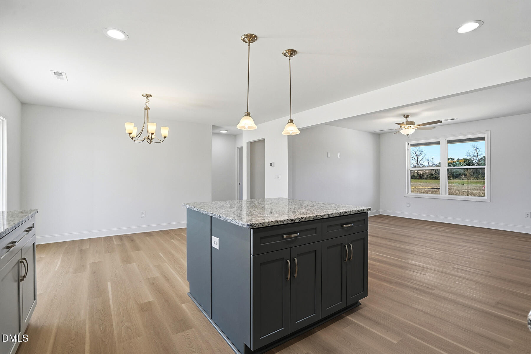 236 Rae Street Warsaw, NC 28398 - Photo 11 of 29 a kitchen with a sink chandelier and wooden floor