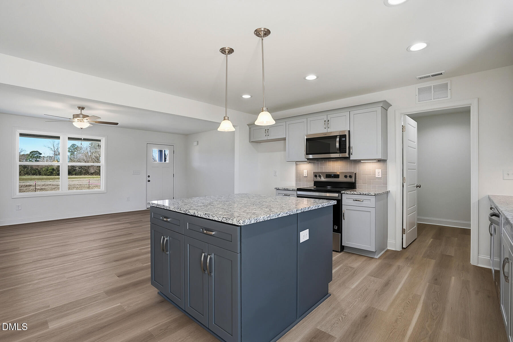 236 Rae Street Warsaw, NC 28398 - Photo 12 of 29 a kitchen with a sink and a stove top oven