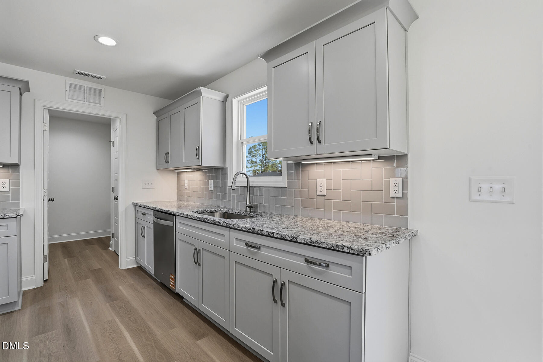 236 Rae Street Warsaw, NC 28398 - Photo 13 of 29 a kitchen with stainless steel appliances granite countertop a sink stove and refrigerator