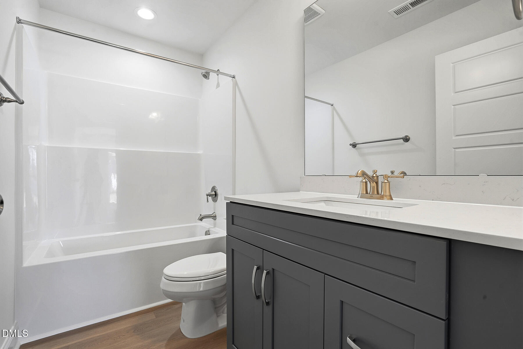 236 Rae Street Warsaw, NC 28398 - Photo 17 of 29 a bathroom with a granite countertop sink toilet a shower and a mirror