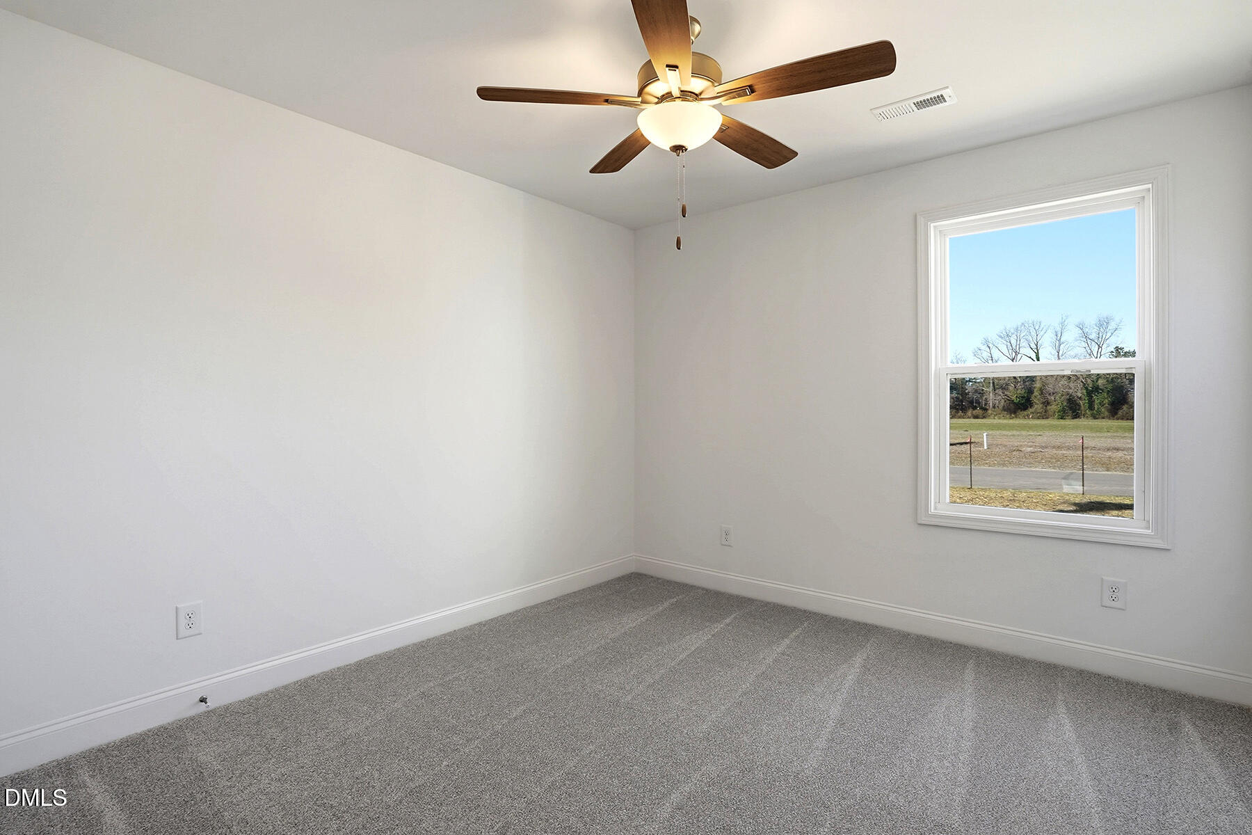 236 Rae Street Warsaw, NC 28398 - Photo 18 of 29 an empty room with a window and a fan
