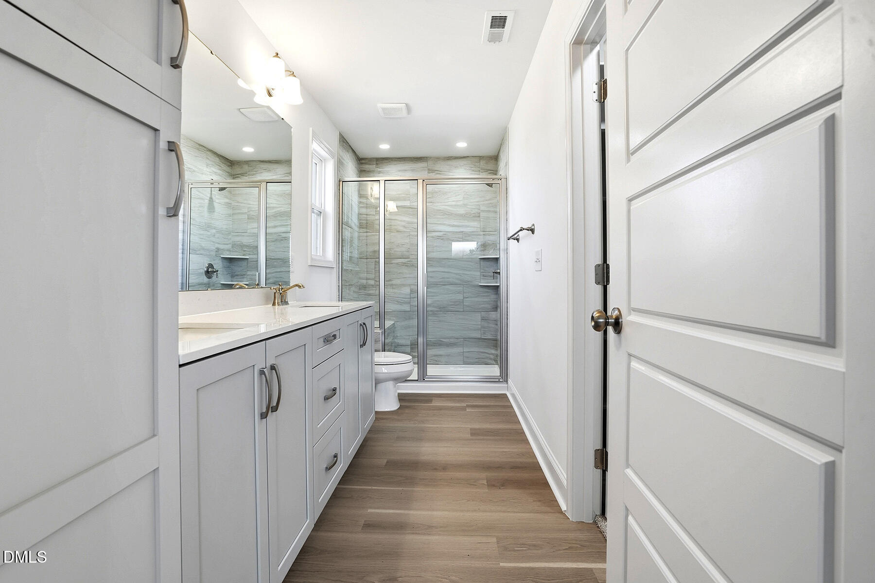 236 Rae Street Warsaw, NC 28398 - Photo 22 of 29 a bathroom with a double vanity sink and a large mirror
