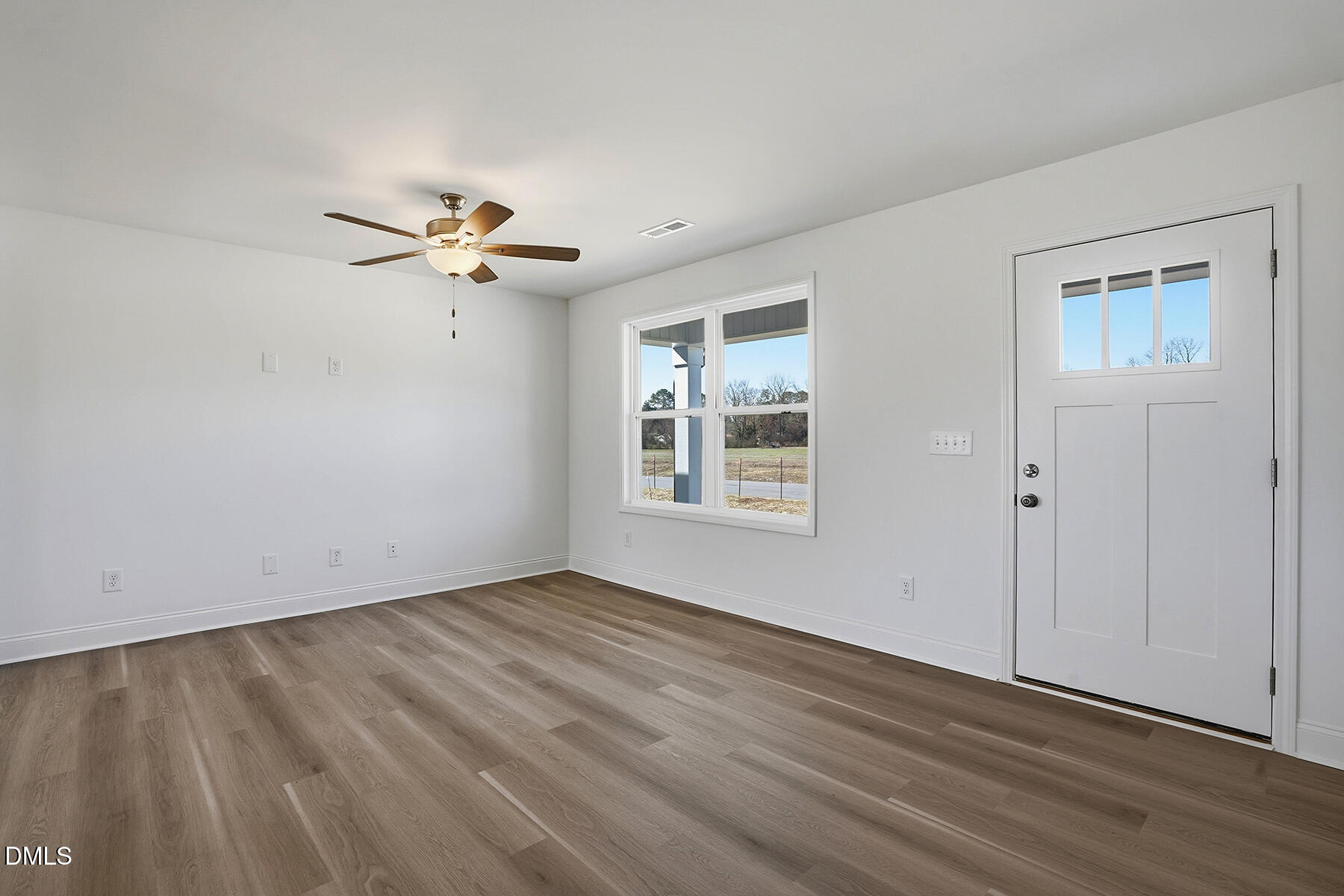 236 Rae Street Warsaw, NC 28398 - Photo 6 of 29 a view of a room with wooden floor and a ceiling fan