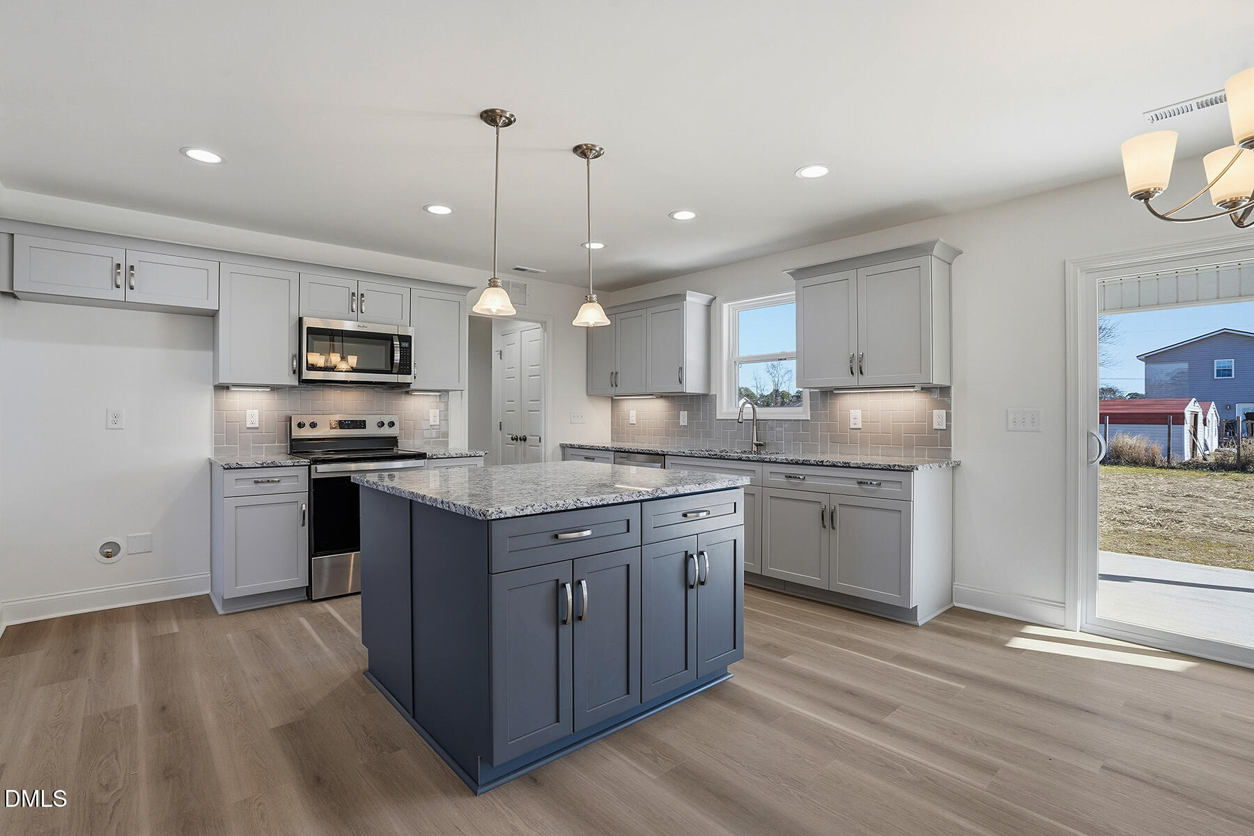236 Rae Street Warsaw, NC 28398 - Photo 8 of 29 a kitchen with stainless steel appliances kitchen island granite countertop a stove a sink a refrigerator and a oven