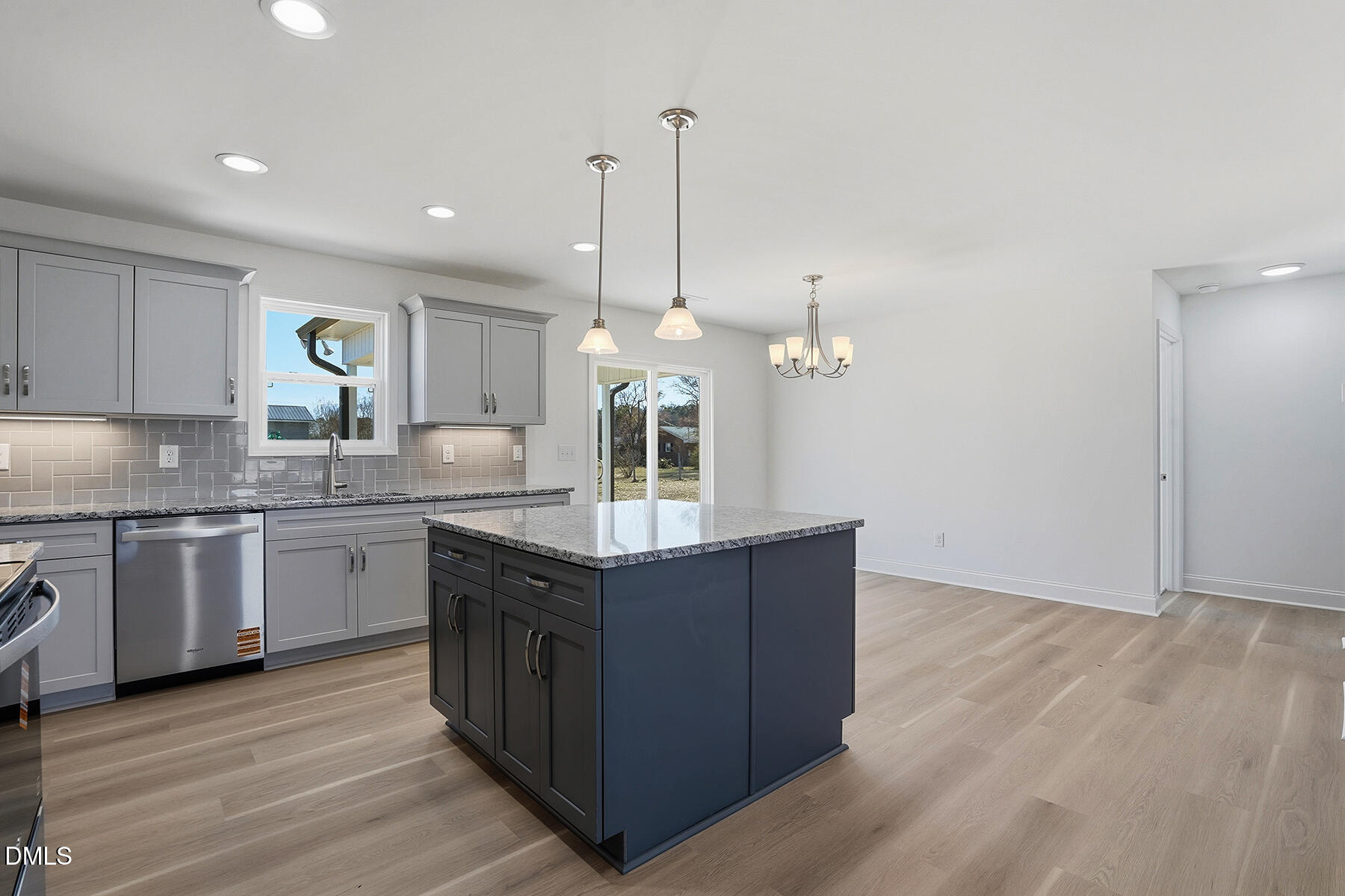 236 Rae Street Warsaw, NC 28398 - Photo 10 of 29 a kitchen with granite countertop wooden cabinets and a stove