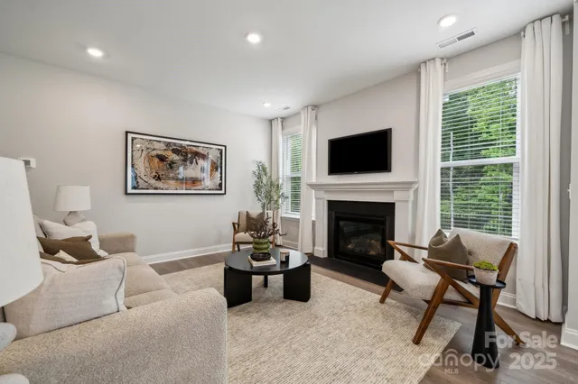 a living room with furniture and a table