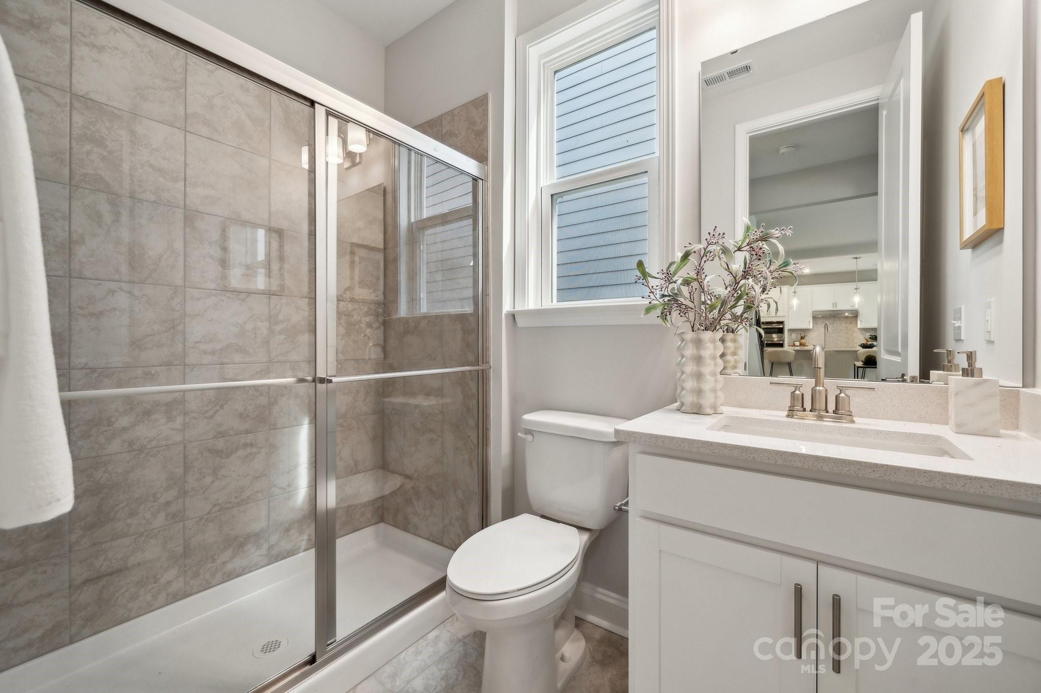 5088 Duval Circle Tega Cay, SC 29708 - Photo 26 of 41 a bathroom with a sink toilet and shower