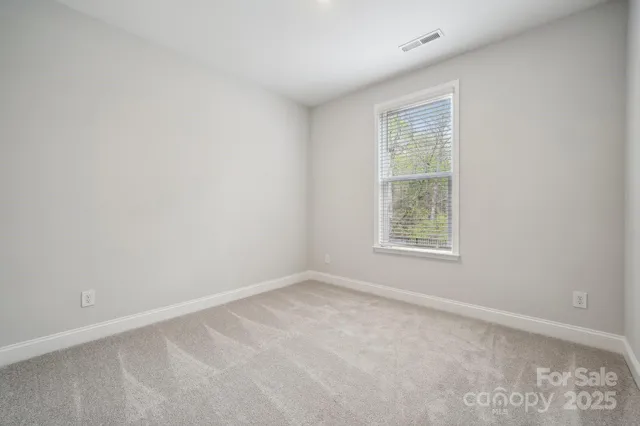 a bathroom with double sink and a mirror