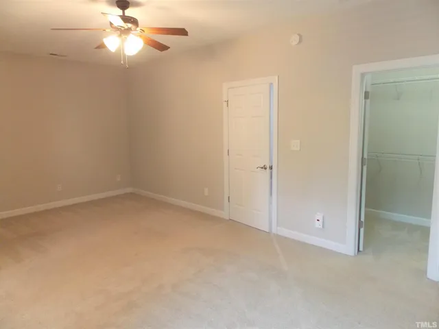 an empty room with a bathroom