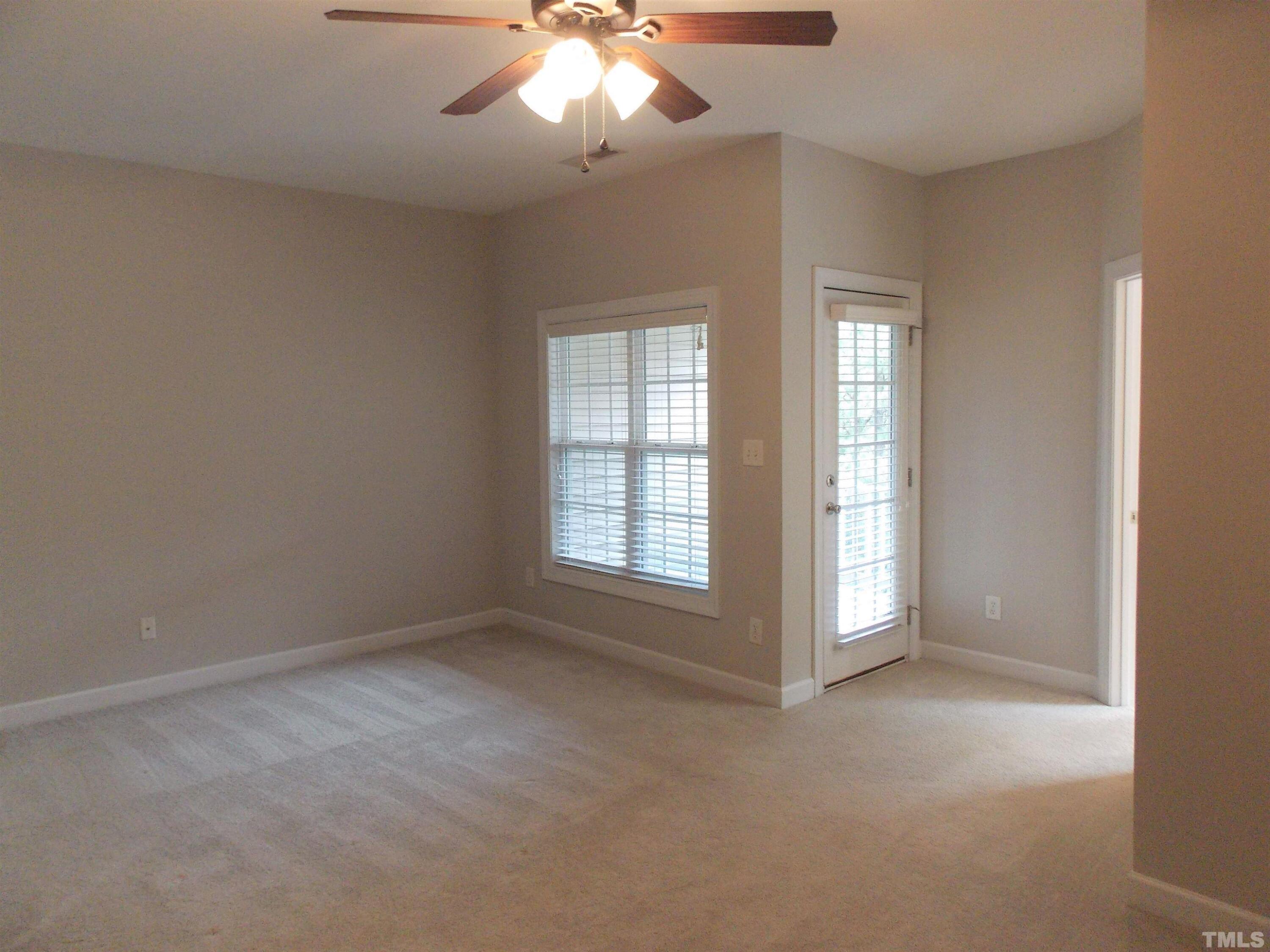 4032 Abbey Park Way Raleigh, NC 27612 - Photo 12 of 35 an empty room with chandelier fan