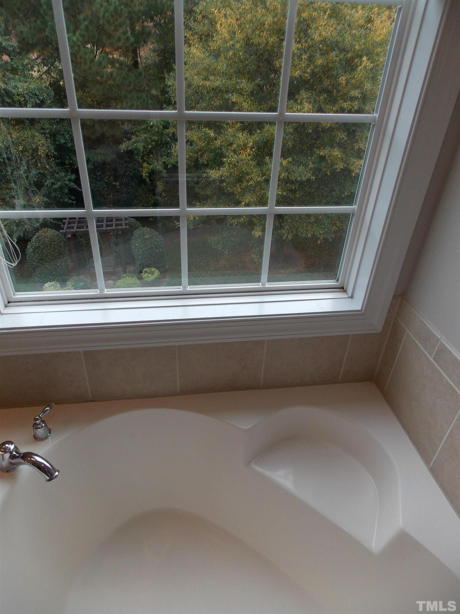 4032 Abbey Park Way Raleigh, NC 27612 - Photo 15 of 35 a view of a bathroom with a window