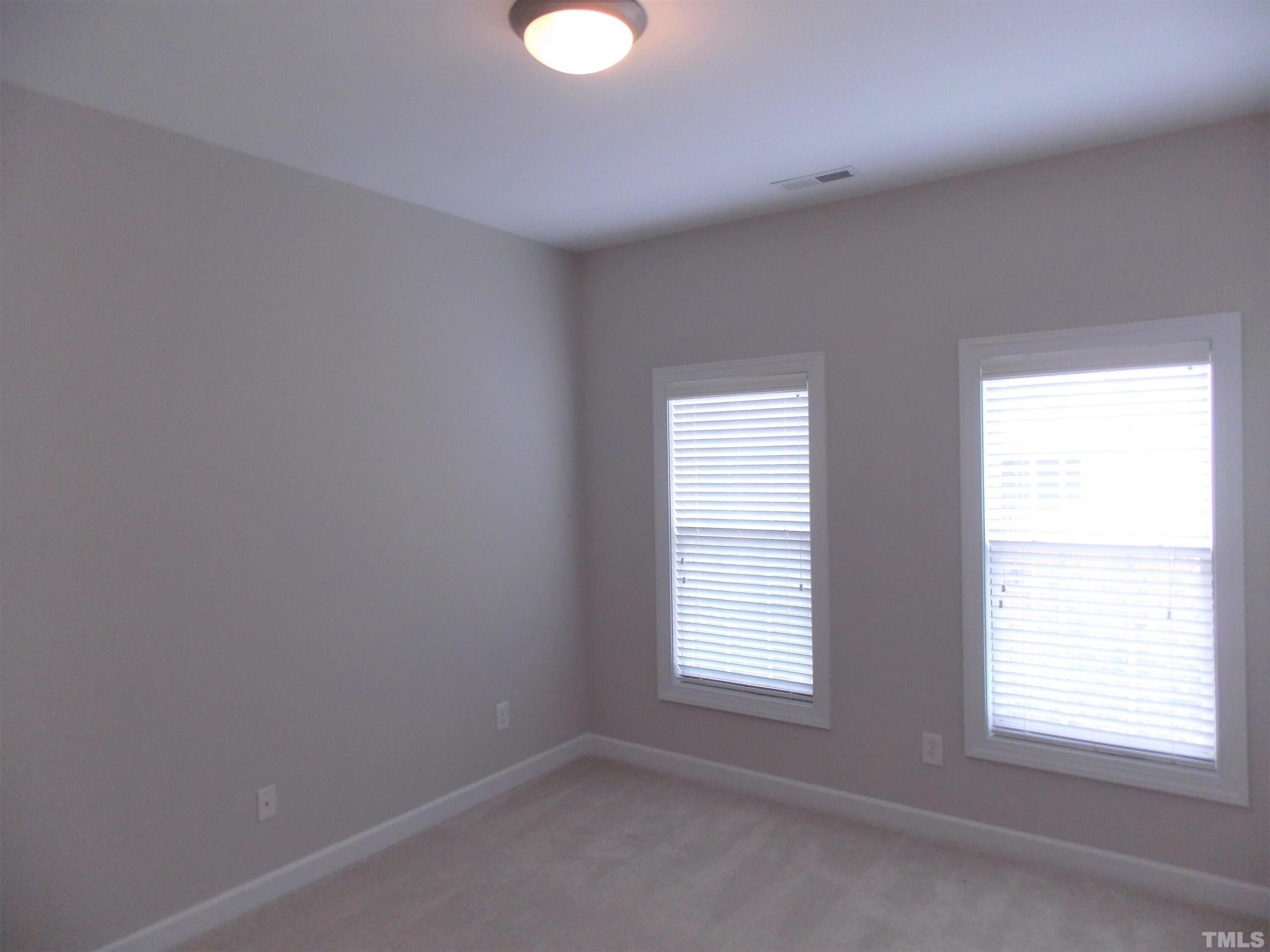 4032 Abbey Park Way Raleigh, NC 27612 - Photo 21 of 35 an empty room with a window