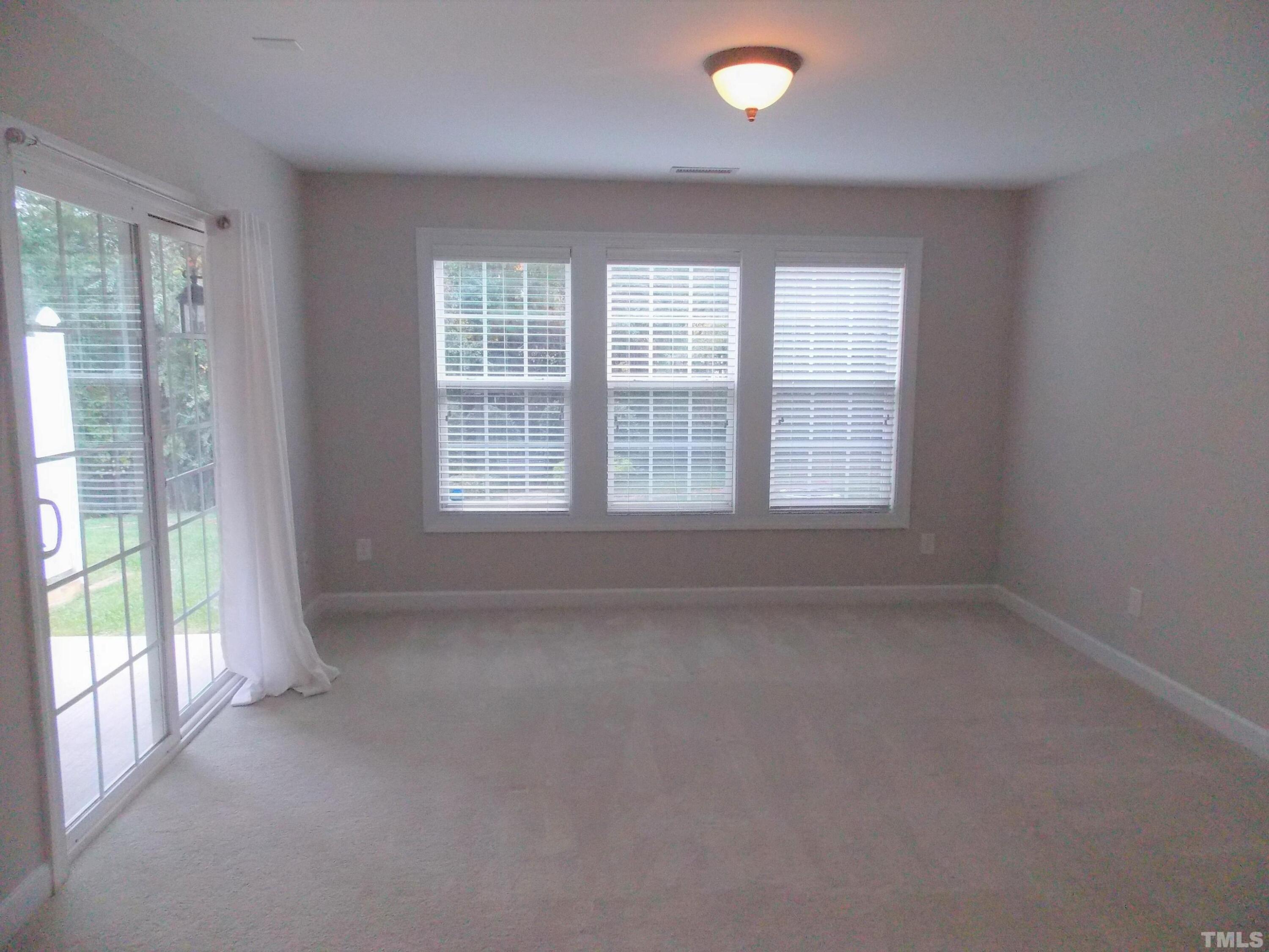 4032 Abbey Park Way Raleigh, NC 27612 - Photo 28 of 35 a view of an empty room with a window