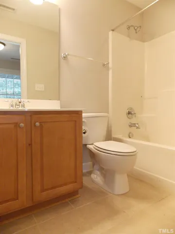 a bathroom with a toilet a sink and shower