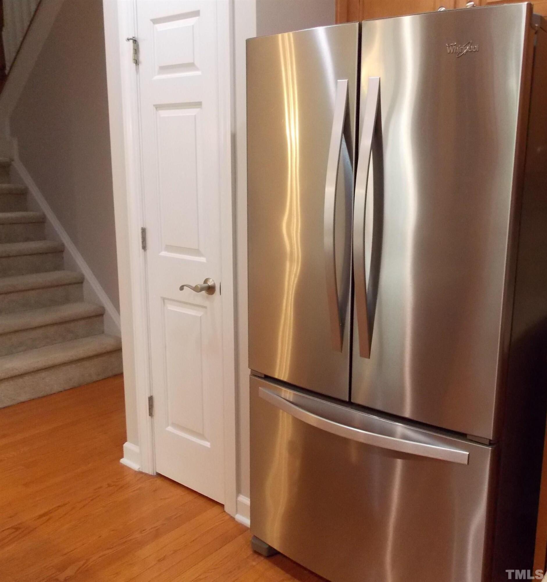 4032 Abbey Park Way Raleigh, NC 27612 - Photo 6 of 35 an empty room with wooden floor