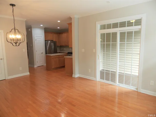a view of a kitchen with a sink dishwasher and a large window