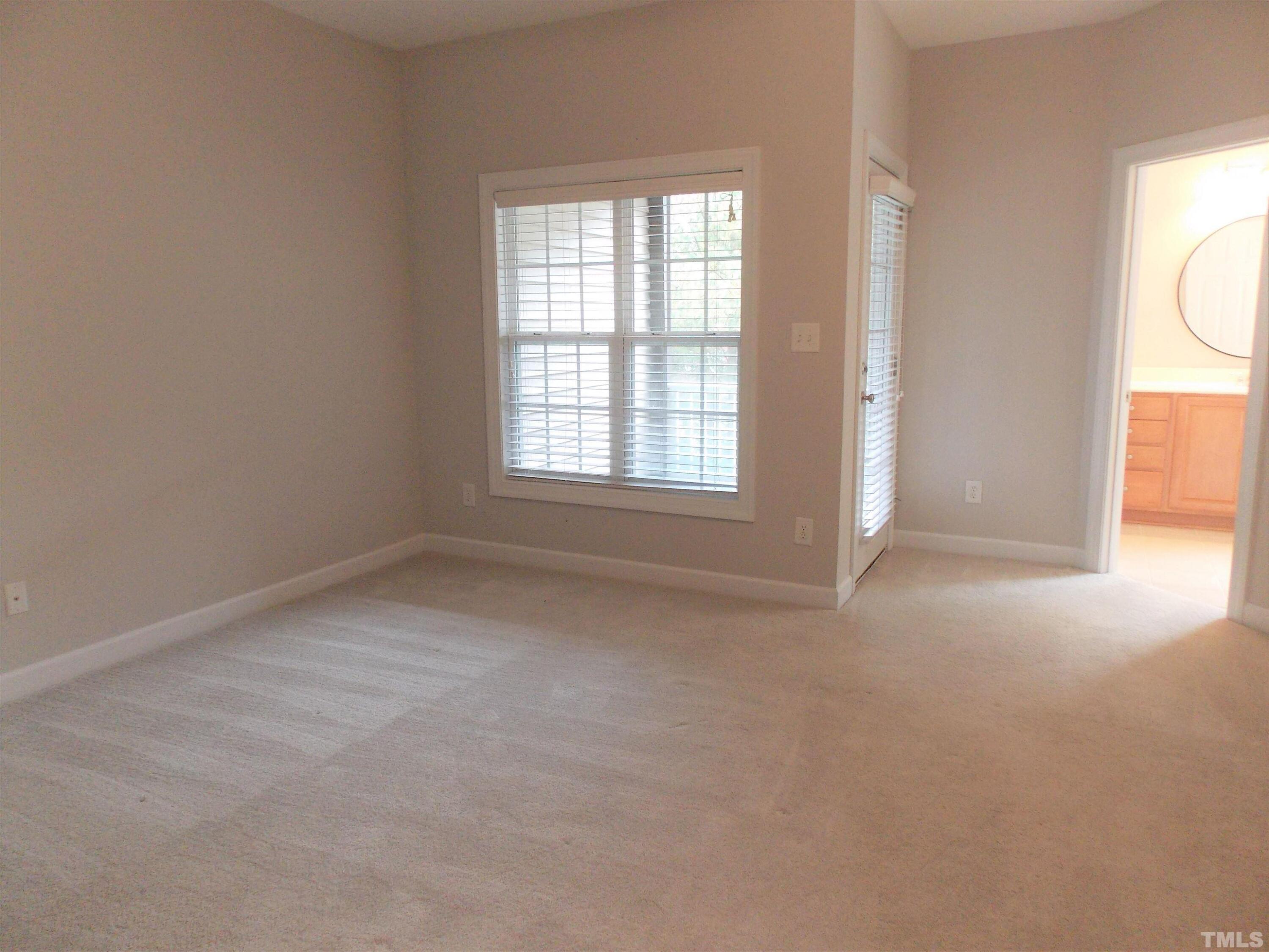 4032 Abbey Park Way Raleigh, NC 27612 - Photo 10 of 35 an empty room with windows