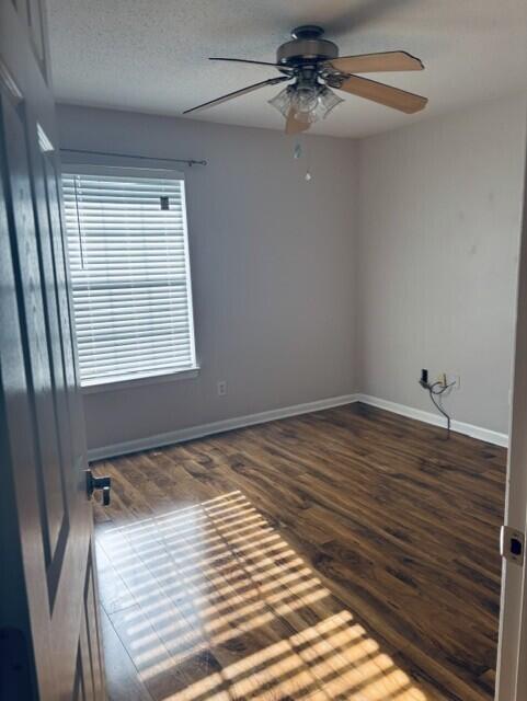 402 Juniper Street Destin, FL 32541 - Photo 14 of 20 a view of a room with wooden floor and fan