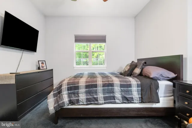 a view of deck with seating and trees