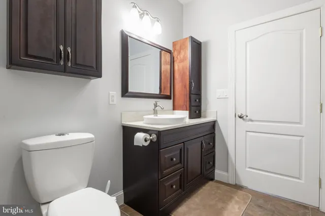 a view of a house with a yard balcony and sitting area