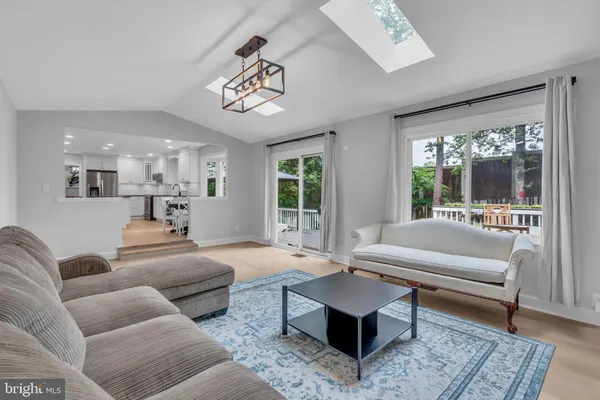 a large kitchen with center island a sink stainless steel appliances and cabinets