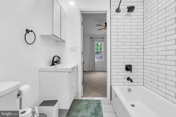 a bedroom with a bed and a mirror