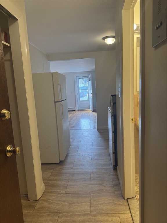 100 Magnolia Avenue, Unit 4 Lynn, MA 01904 - Photo 17 of 19 a view of a kitchen from a hallway