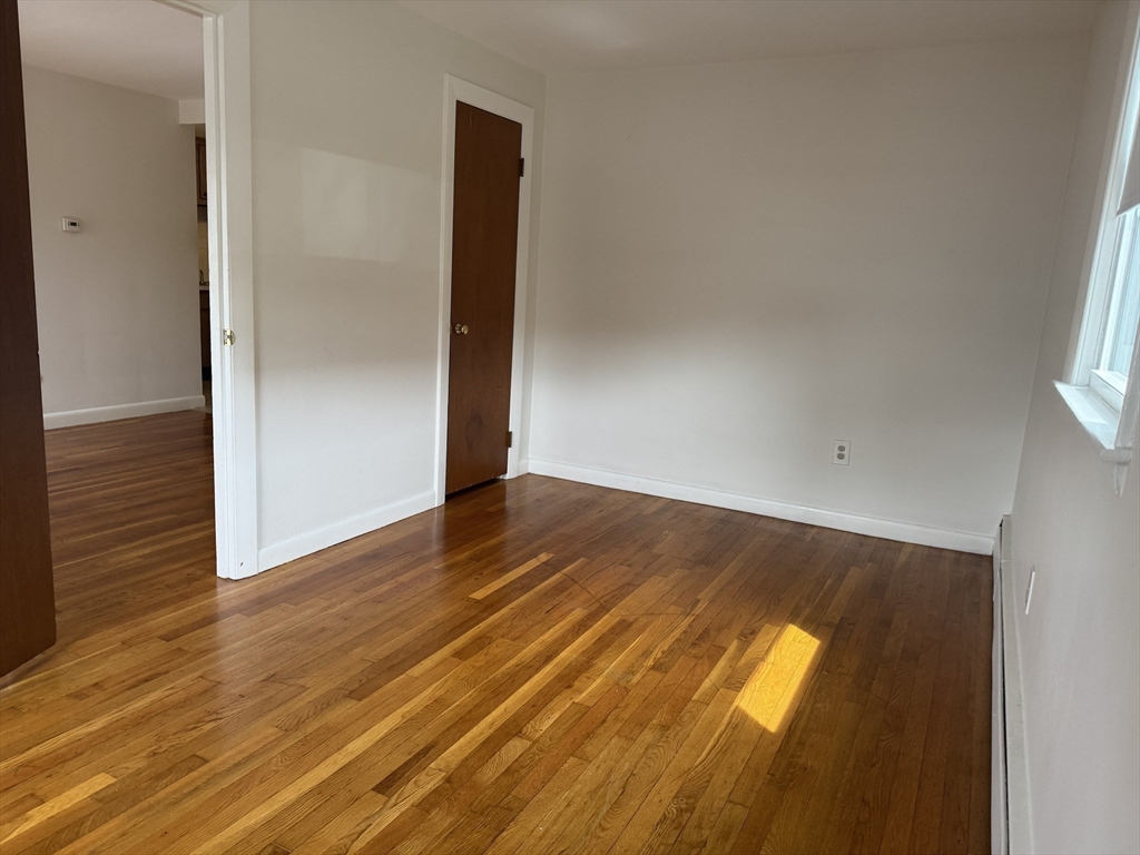100 Magnolia Avenue, Unit 4 Lynn, MA 01904 - Photo 4 of 19 a view of an empty room with wooden floor