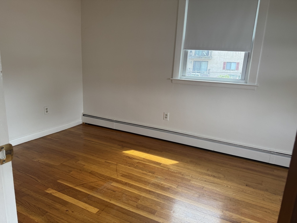 100 Magnolia Avenue, Unit 4 Lynn, MA 01904 - Photo 9 of 19 a view of a room with wooden floor