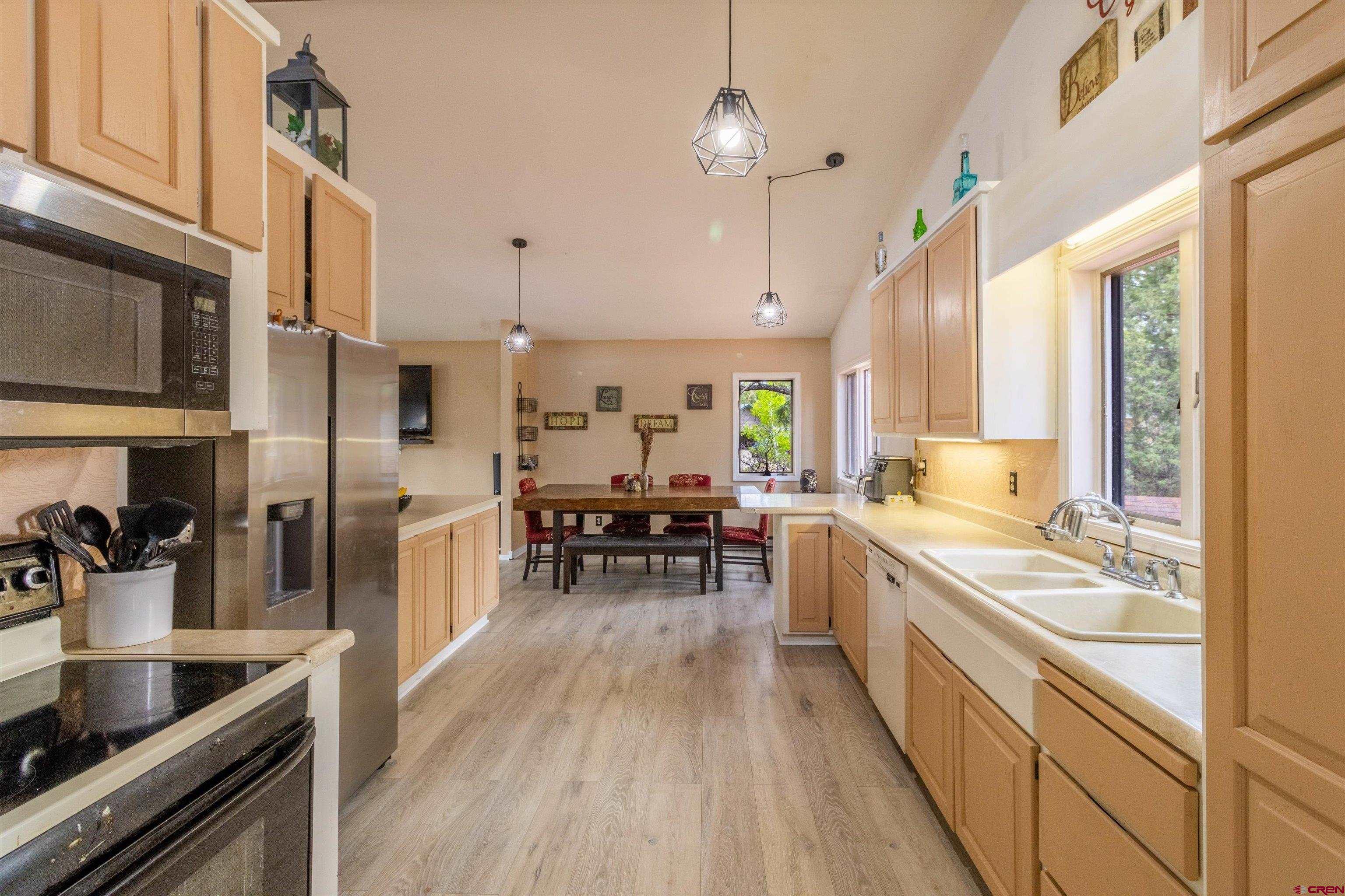 67 Pine Ridge Loop Durango, CO 81301 - Photo 11 of 35 a kitchen with lots of counter top space and stainless steel appliances