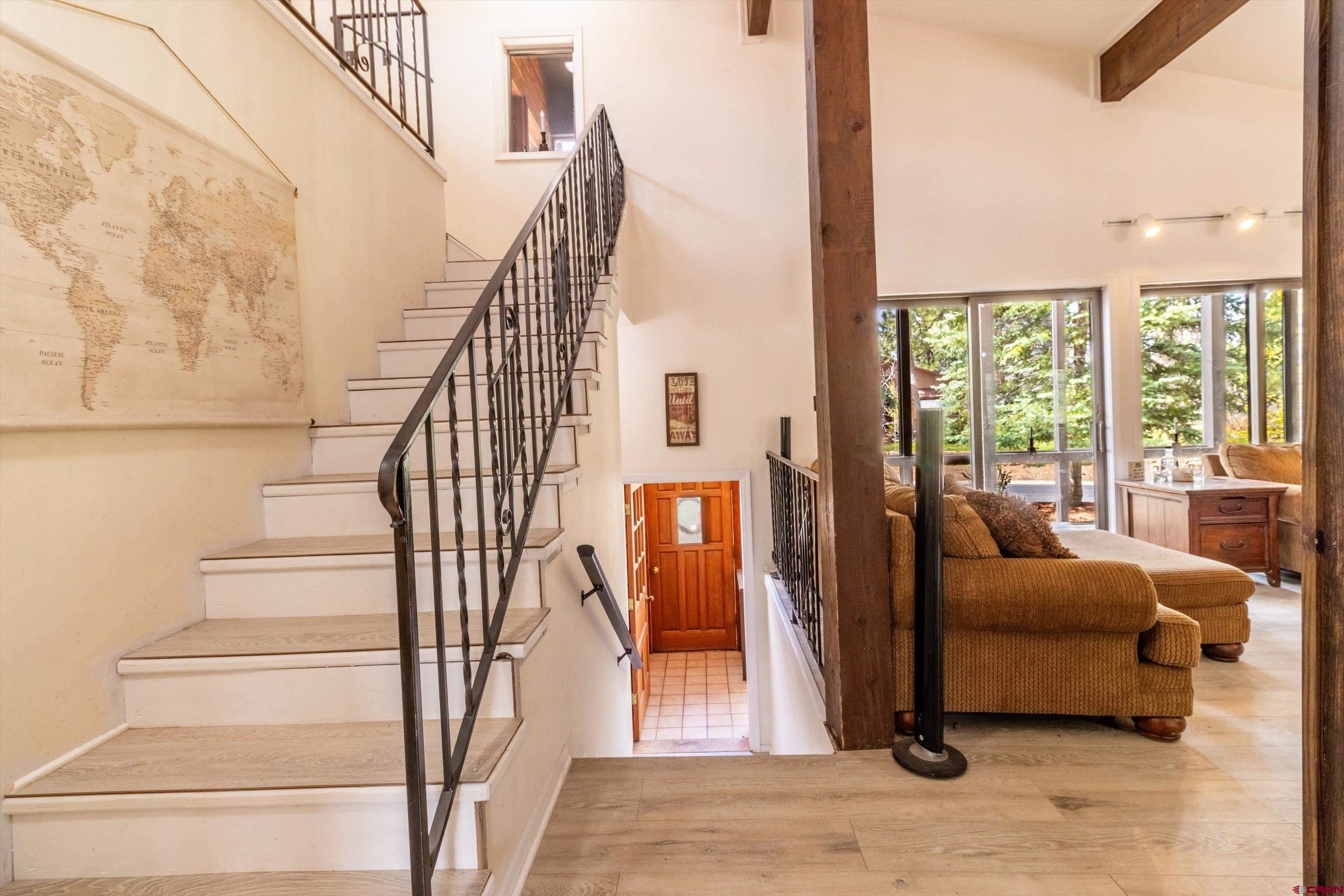 67 Pine Ridge Loop Durango, CO 81301 - Photo 12 of 35 a view of entryway and hall with wooden floor