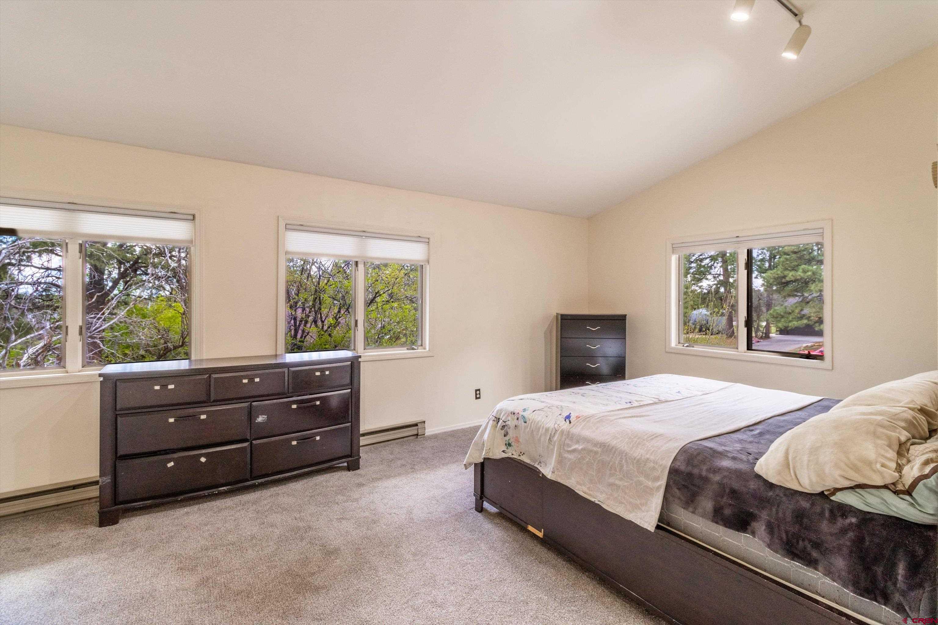 67 Pine Ridge Loop Durango, CO 81301 - Photo 14 of 35 a bedroom with a bed and window