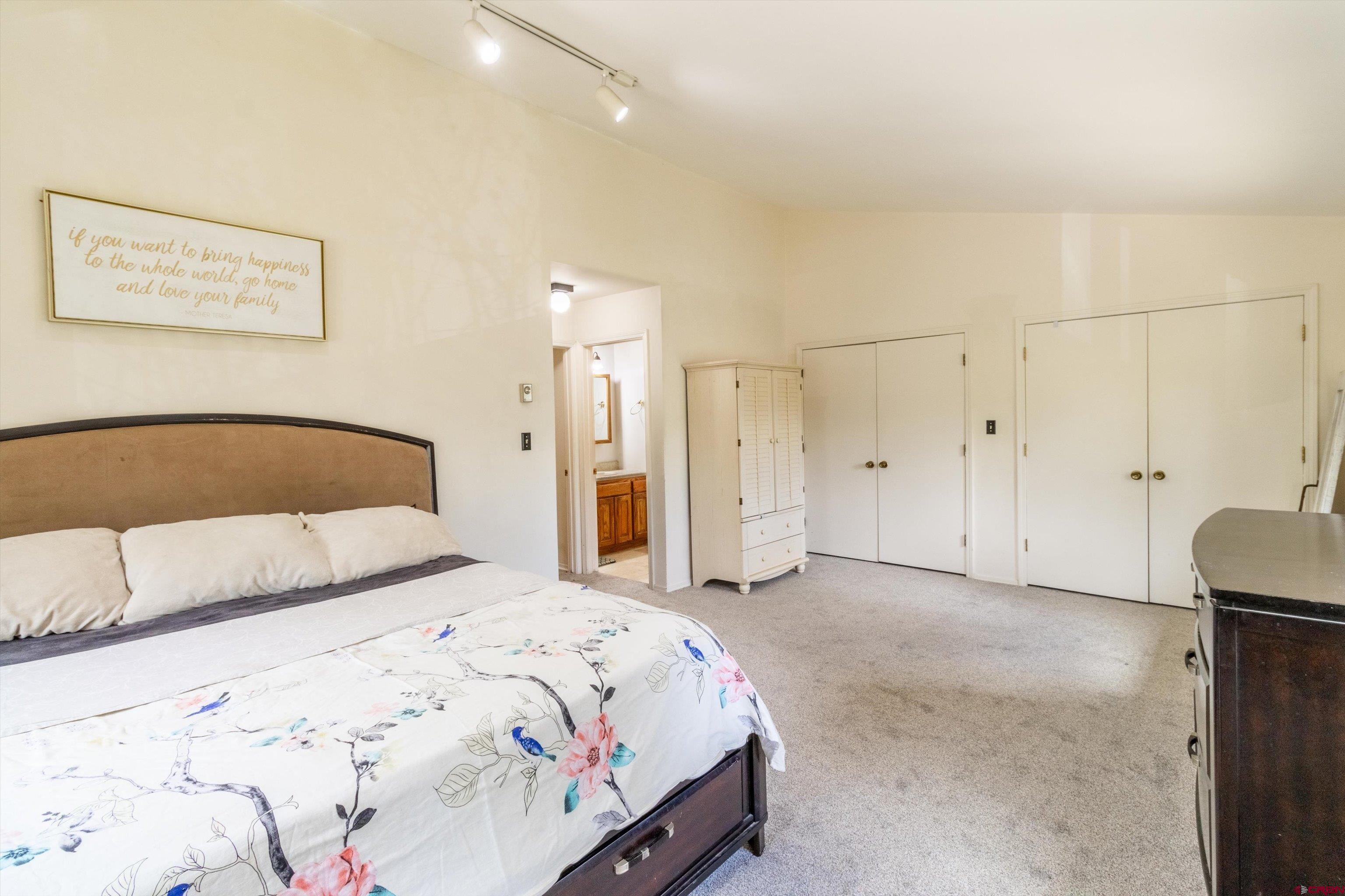 67 Pine Ridge Loop Durango, CO 81301 - Photo 16 of 35 a bedroom with a bed and a cabinets