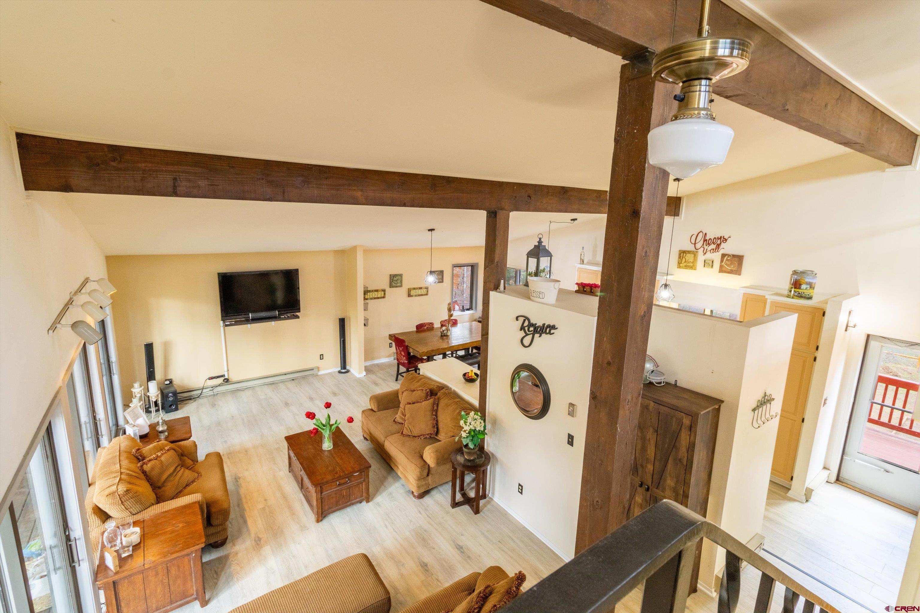 67 Pine Ridge Loop Durango, CO 81301 - Photo 21 of 35 a living room with furniture and a flat screen tv