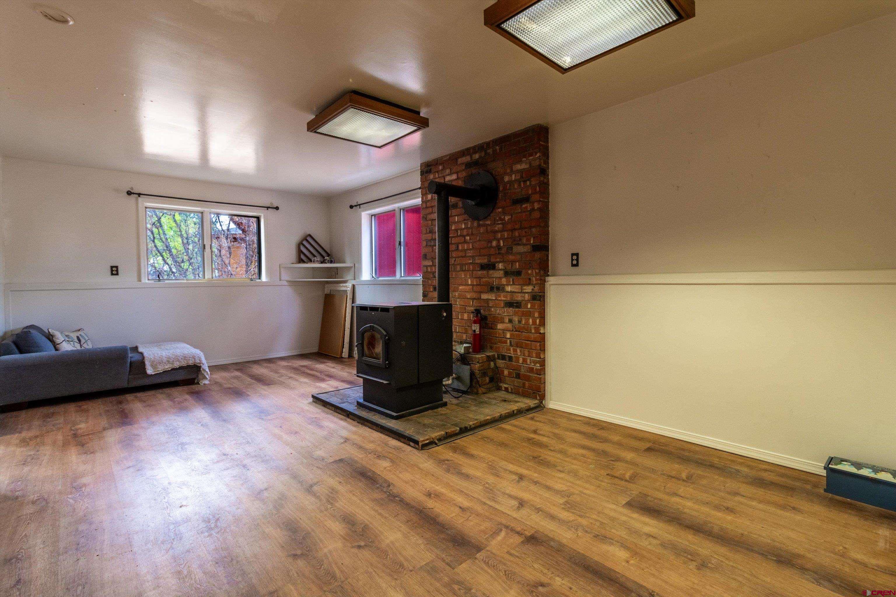 67 Pine Ridge Loop Durango, CO 81301 - Photo 23 of 35 a living room with furniture and a fireplace