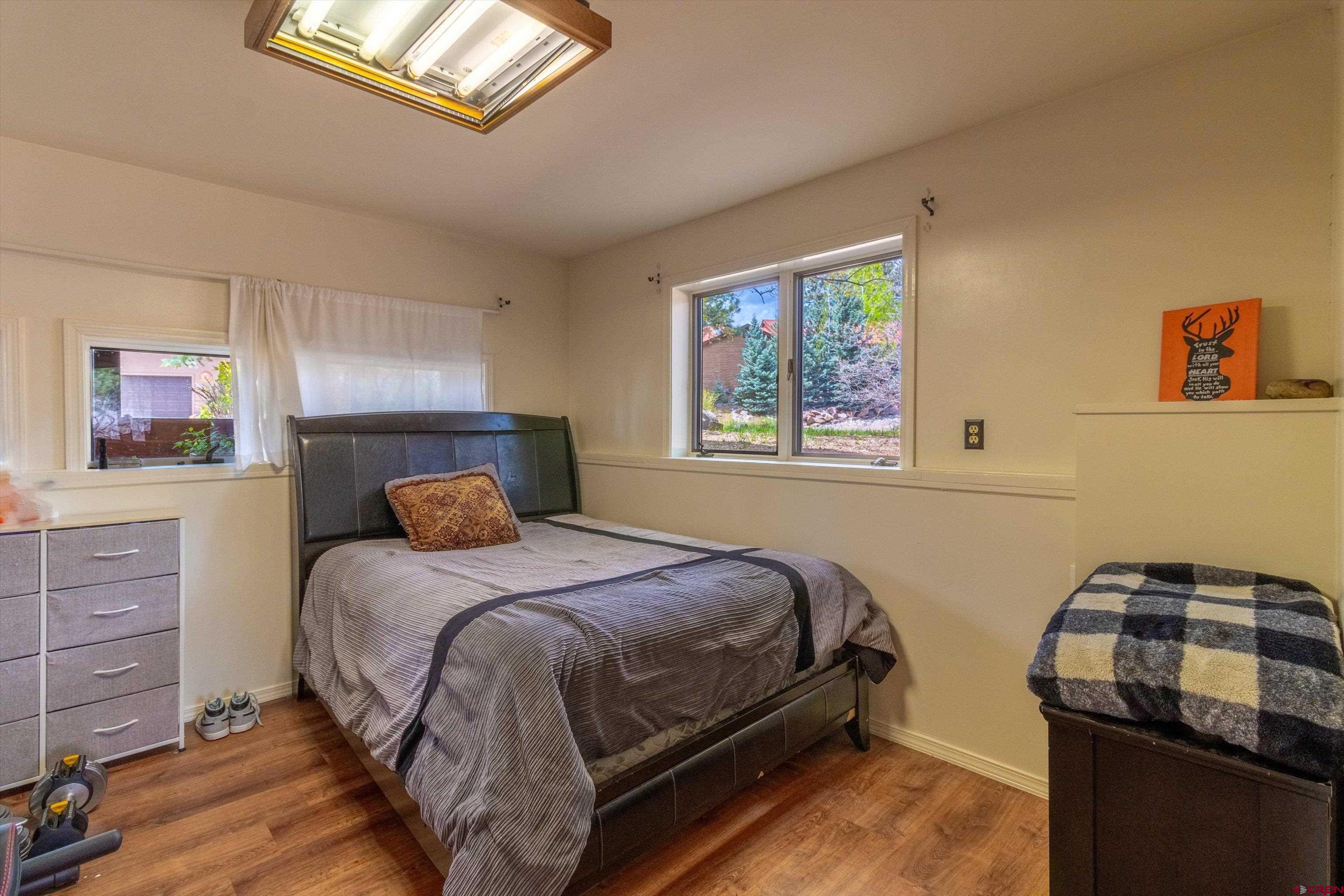 67 Pine Ridge Loop Durango, CO 81301 - Photo 25 of 35 a bedroom with a bed and a window