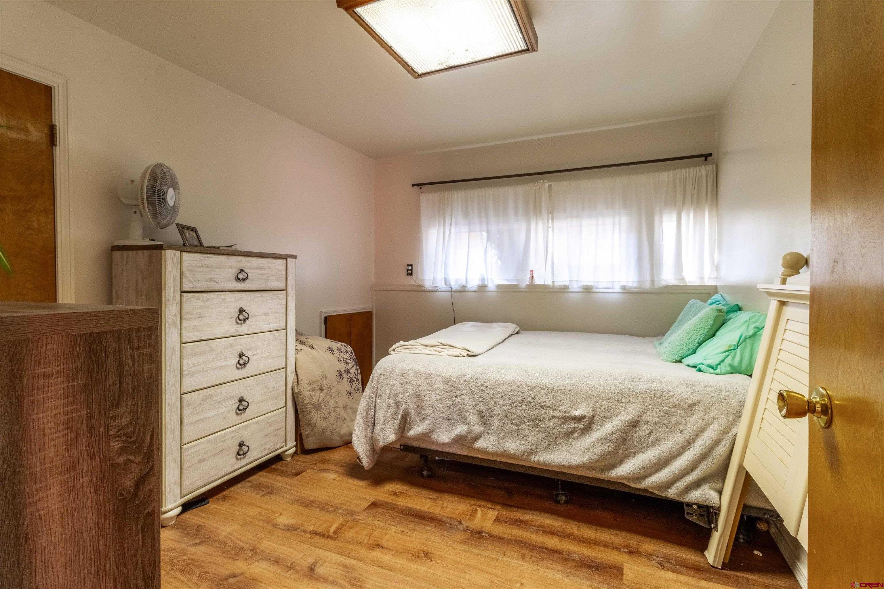 67 Pine Ridge Loop Durango, CO 81301 - Photo 26 of 35 a bedroom with a bed and a dresser