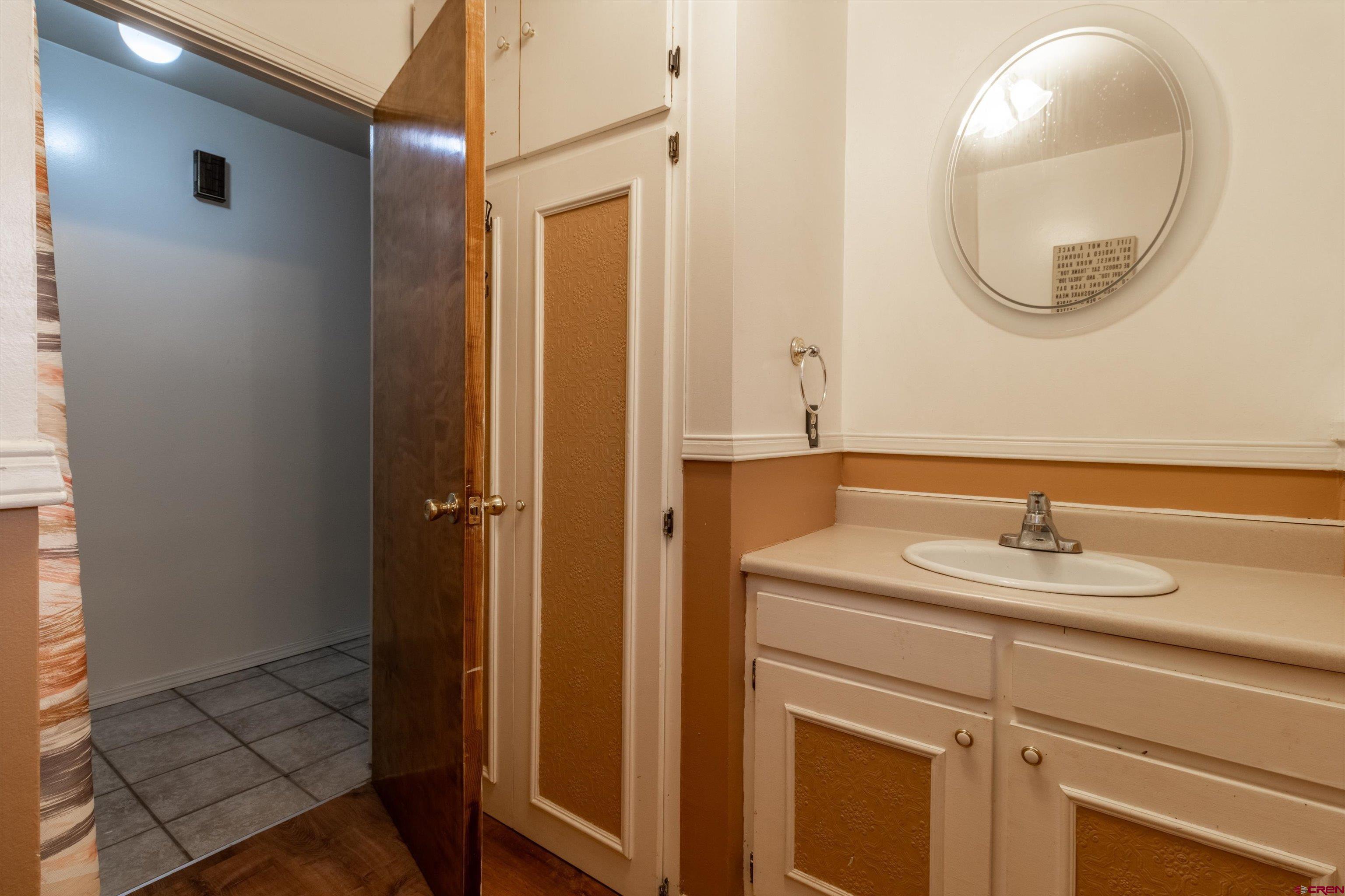 67 Pine Ridge Loop Durango, CO 81301 - Photo 27 of 35 a bathroom with a sink and a mirror